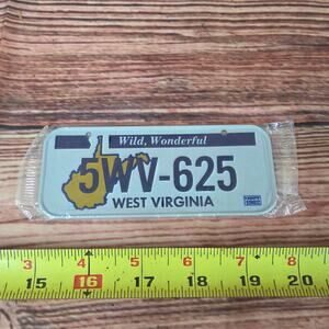 Vintage 1980s steel mini license plate West Virginia sealed white